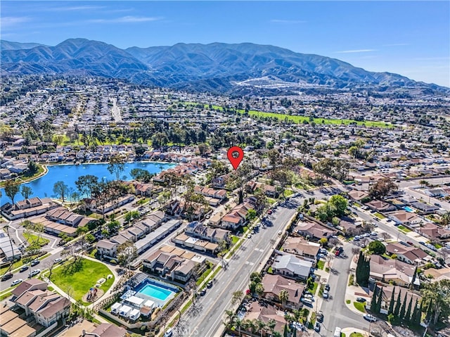 birds eye view of property featuring a residential view and a water and mountain view