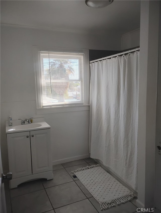 bathroom with tile patterned floors, curtained shower, and vanity