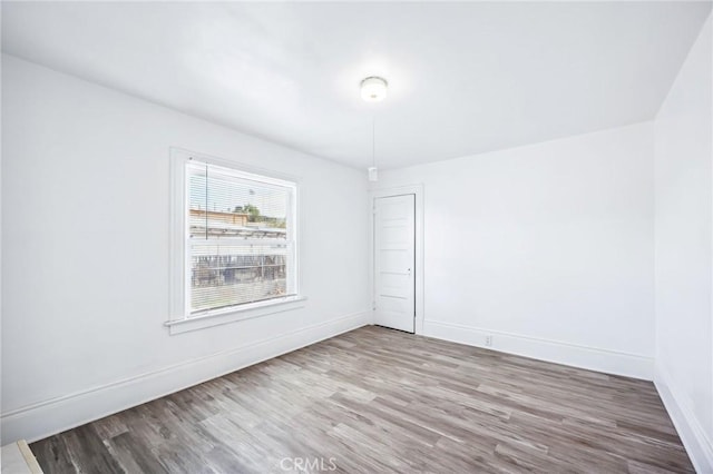 401 Cibola St, Needles, CA 92363 - empty room with wood finished floors and baseboards