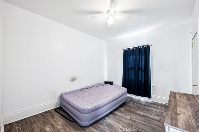 401 Cibola St, Needles, CA 92363 - bedroom featuring baseboards, wood finished floors, and ceiling fan