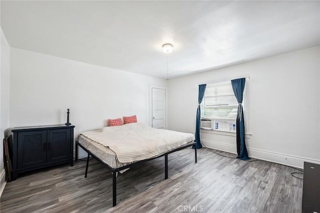 401 Cibola St, Needles, CA 92363 - bedroom featuring wood finished floors, baseboards, and cooling unit