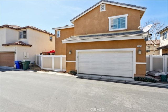 33971 Lily Rd, Yucaipa, CA 92399 - view of front of house with stucco siding, a garage, and a tiled roof