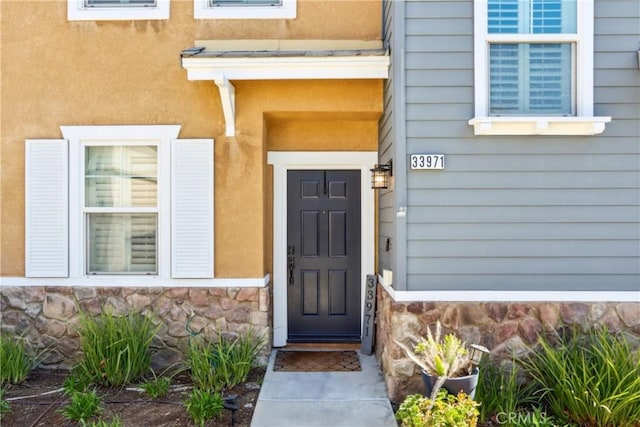 33971 Lily Rd, Yucaipa, CA 92399 - property entrance with stone siding and stucco siding
