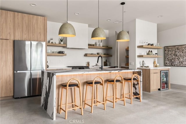 kitchen with wine cooler, modern cabinets, freestanding refrigerator, and open shelves