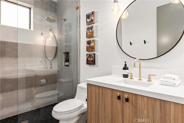 full bath featuring vanity, tile patterned floors, toilet, and tiled shower