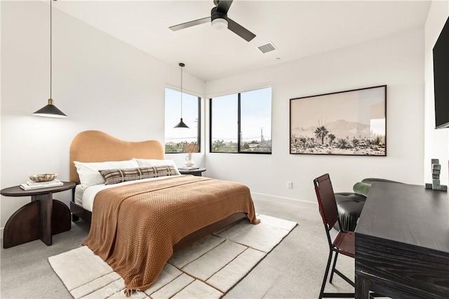 bedroom featuring a ceiling fan, light colored carpet, visible vents, and baseboards