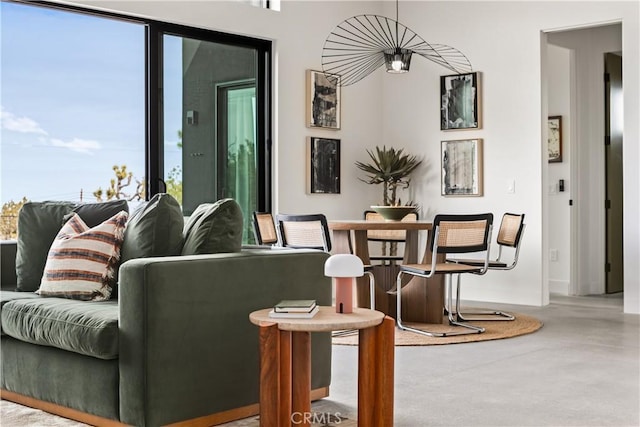 living area with concrete flooring