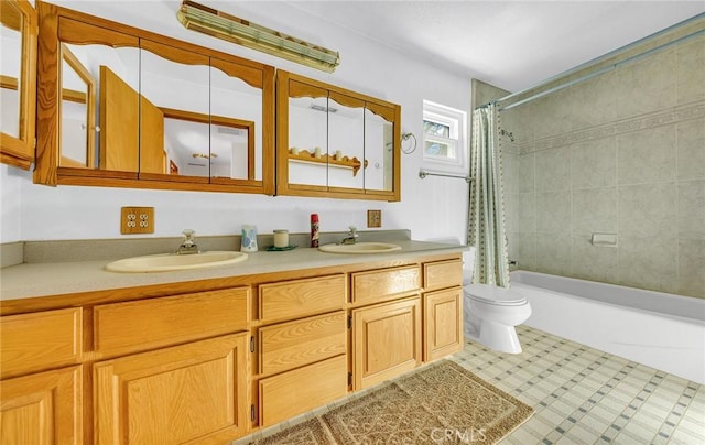 full bathroom with double vanity, toilet, shower / bath combo, and a sink