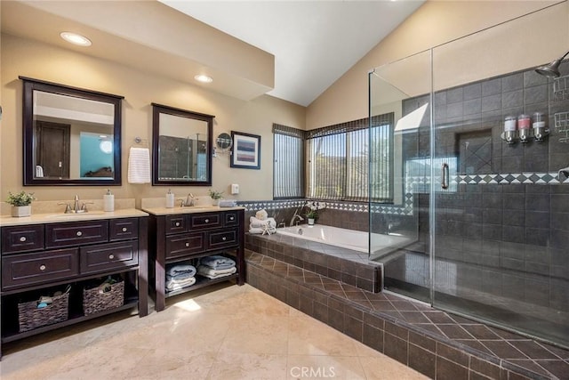 bathroom with vanity, lofted ceiling, tile patterned flooring, a shower stall, and a bath