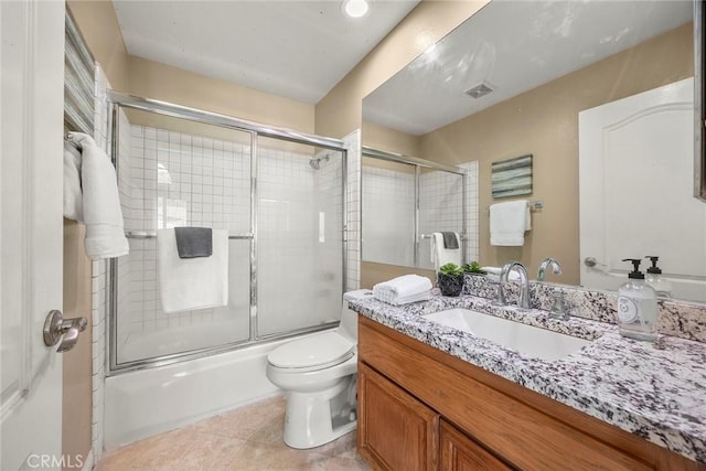 full bath with visible vents, toilet, tile patterned flooring, enclosed tub / shower combo, and vanity