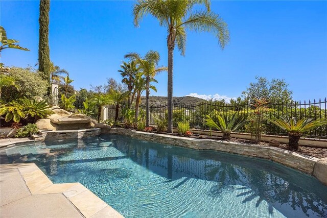 view of pool with a fenced backyard and a fenced in pool