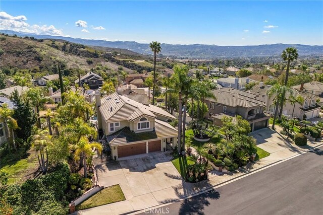 aerial view featuring a mountain view and a residential view