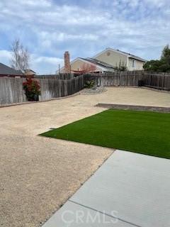 view of yard with a patio area and a fenced backyard