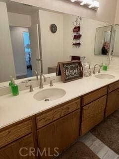 full bathroom featuring double vanity and a sink