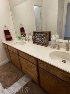 bathroom with double vanity and a sink