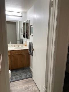 bathroom featuring vanity and wood finished floors