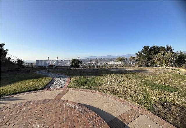 exterior space with a deck with mountain view