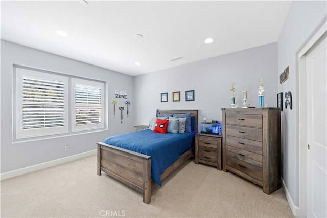 bedroom featuring visible vents, recessed lighting, light colored carpet, and baseboards