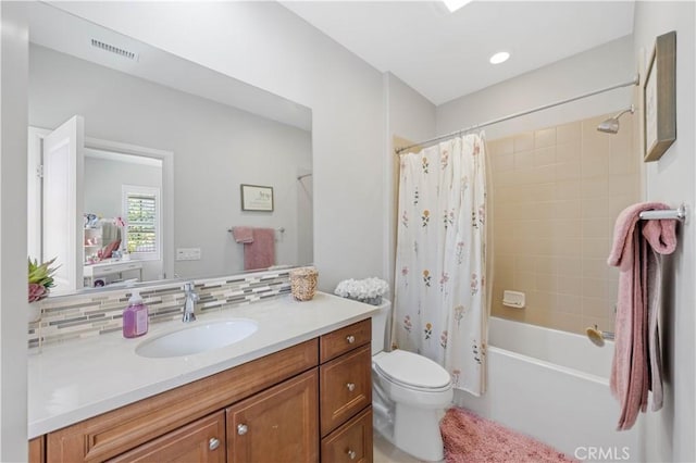 full bathroom with visible vents, shower / tub combo with curtain, toilet, backsplash, and vanity