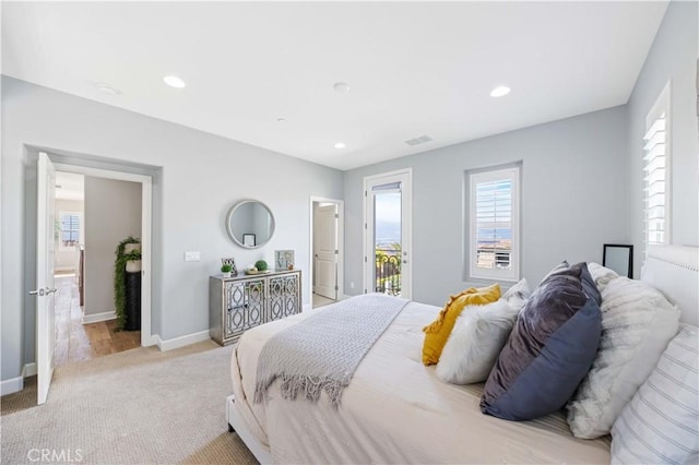 bedroom with visible vents, baseboards, light colored carpet, recessed lighting, and access to outside