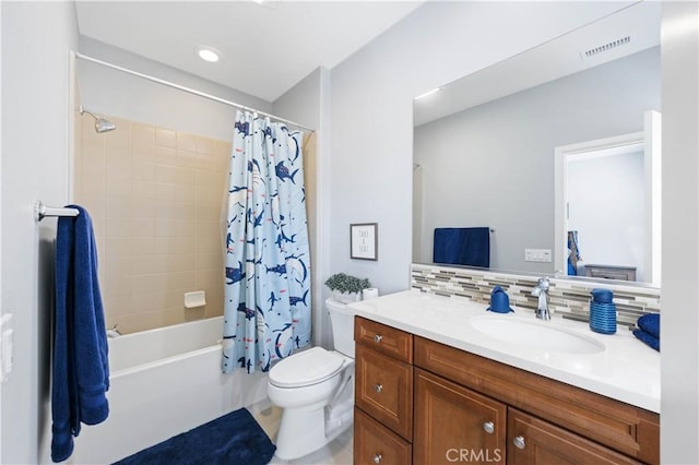 bathroom with vanity, visible vents, shower / bath combo, decorative backsplash, and toilet