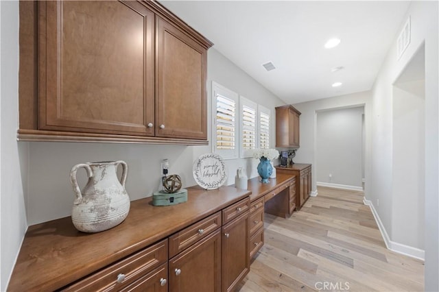 interior space with recessed lighting, visible vents, baseboards, and light wood finished floors