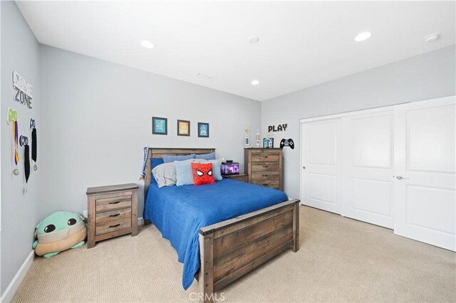 carpeted bedroom with recessed lighting, a closet, and baseboards