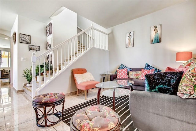 living room with stairway, baseboards, and marble finish floor