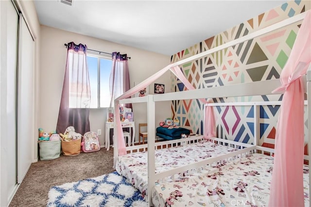 carpeted bedroom featuring a closet