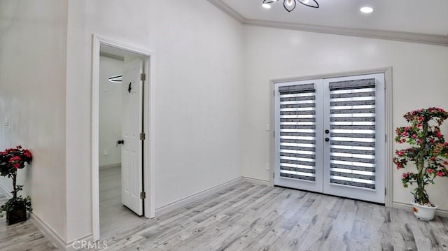 interior space with french doors, light wood-style floors, crown molding, and access to outside