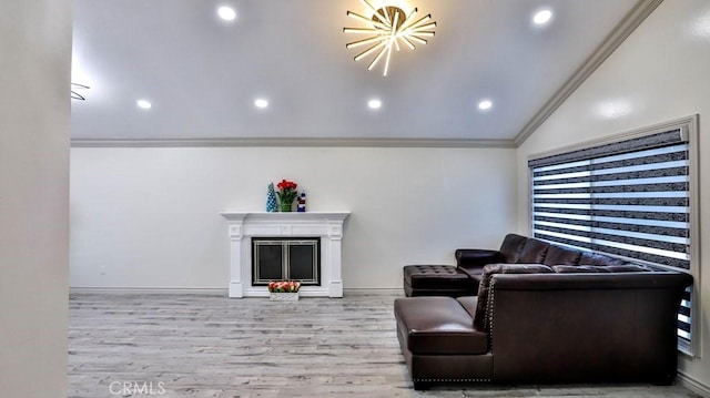 living room featuring light wood-style flooring, recessed lighting, a fireplace, vaulted ceiling, and crown molding