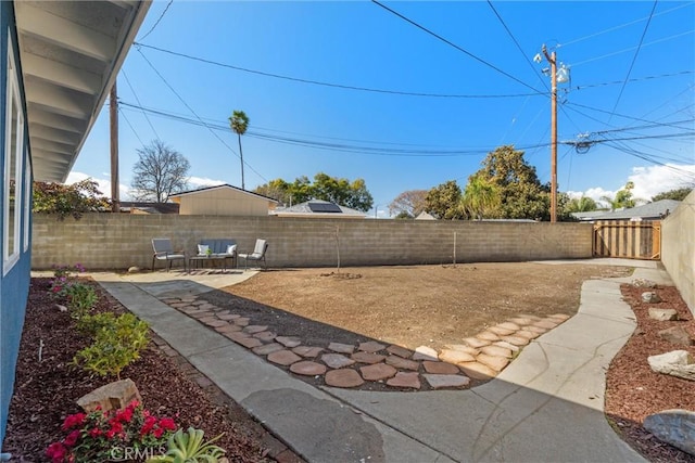 view of yard with a patio and a fenced backyard