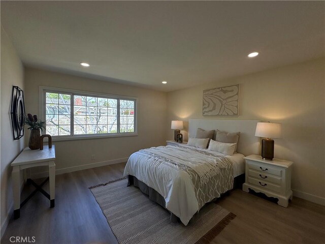 bedroom featuring recessed lighting, baseboards, and wood finished floors