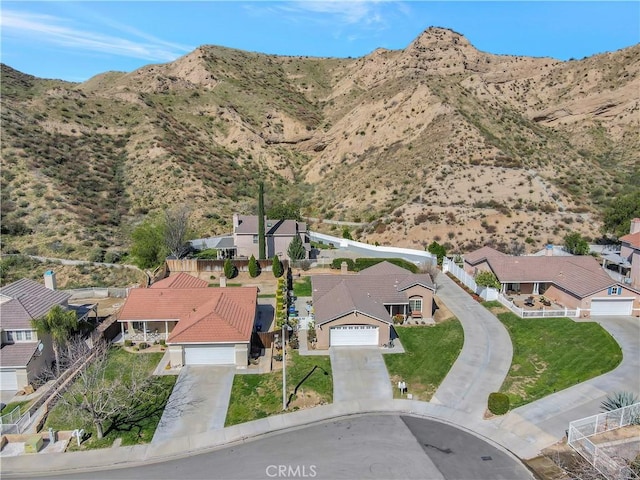 drone / aerial view featuring a residential view and a mountain view