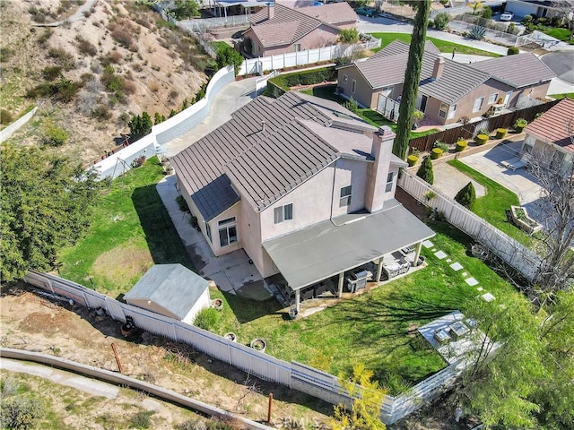 birds eye view of property with a residential view