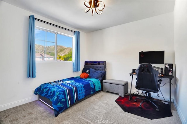 bedroom with carpet flooring and baseboards