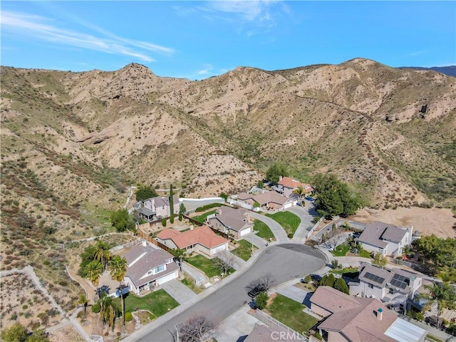 birds eye view of property featuring a mountain view and a residential view