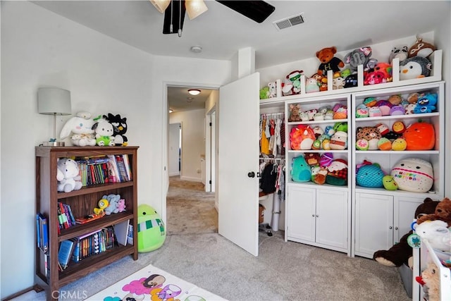 playroom featuring visible vents, ceiling fan, and carpet