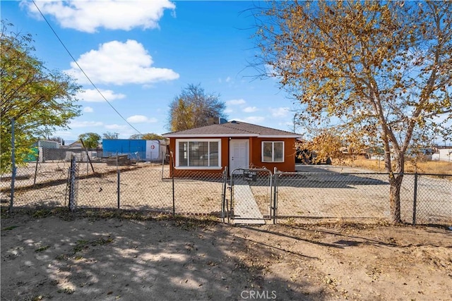 bungalow with a gate and a fenced front yard