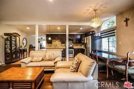 living room featuring recessed lighting and dark wood-style flooring