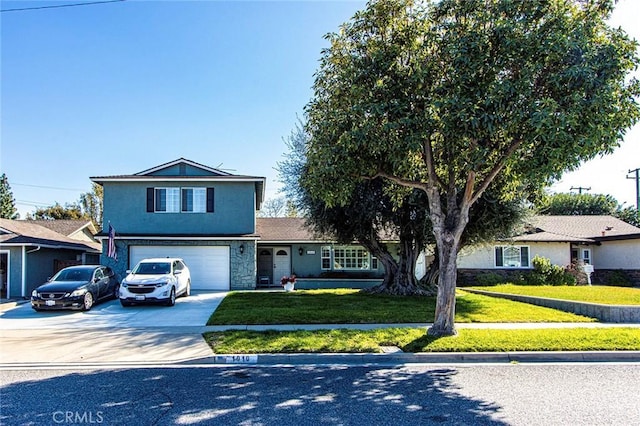 traditional-style house featuring stucco siding, driveway, an attached garage, and a front yard