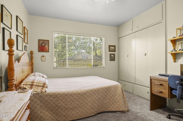 carpeted bedroom with a closet and ceiling fan