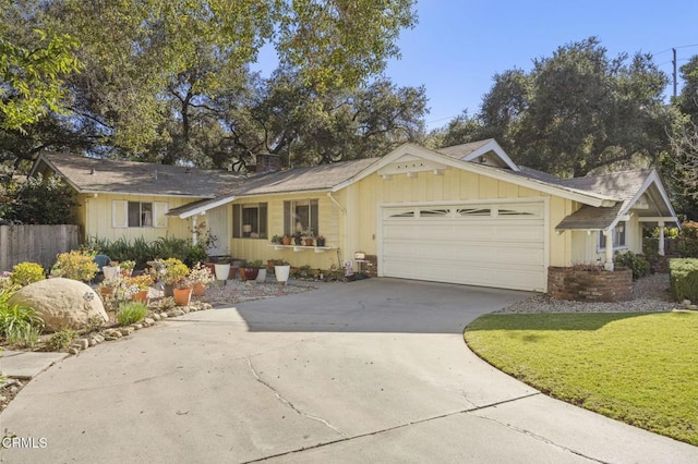 ranch-style home with board and batten siding, fence, concrete driveway, a chimney, and an attached garage