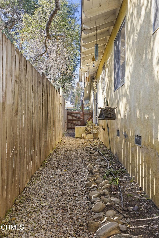 view of home's exterior featuring crawl space, stucco siding, and a fenced backyard