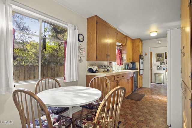 dining area with brick floor