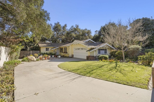 view of front of home featuring board and batten siding, a front lawn, fence, concrete driveway, and a garage