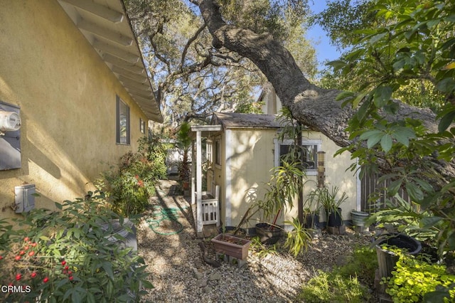 view of side of home featuring stucco siding