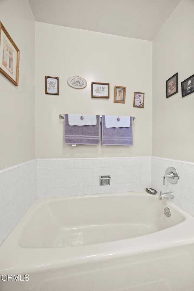 full bathroom with a garden tub