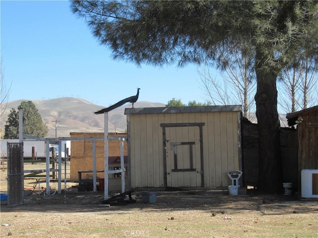 view of poultry coop featuring a mountain view and central AC