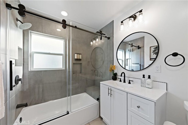 full bath with combined bath / shower with glass door, toilet, and vanity